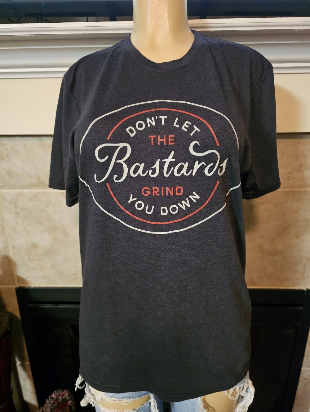 Dark Gray Graphic "Don't Let the Bastards Grind You Down" T-shirt. Size Medium